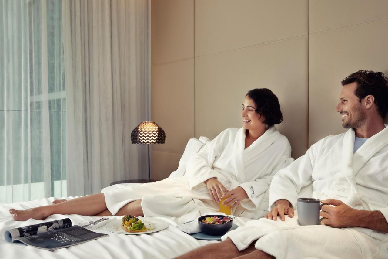 The Westin Brisbane Hotel Bagian luar foto A couple wearing bathrobes