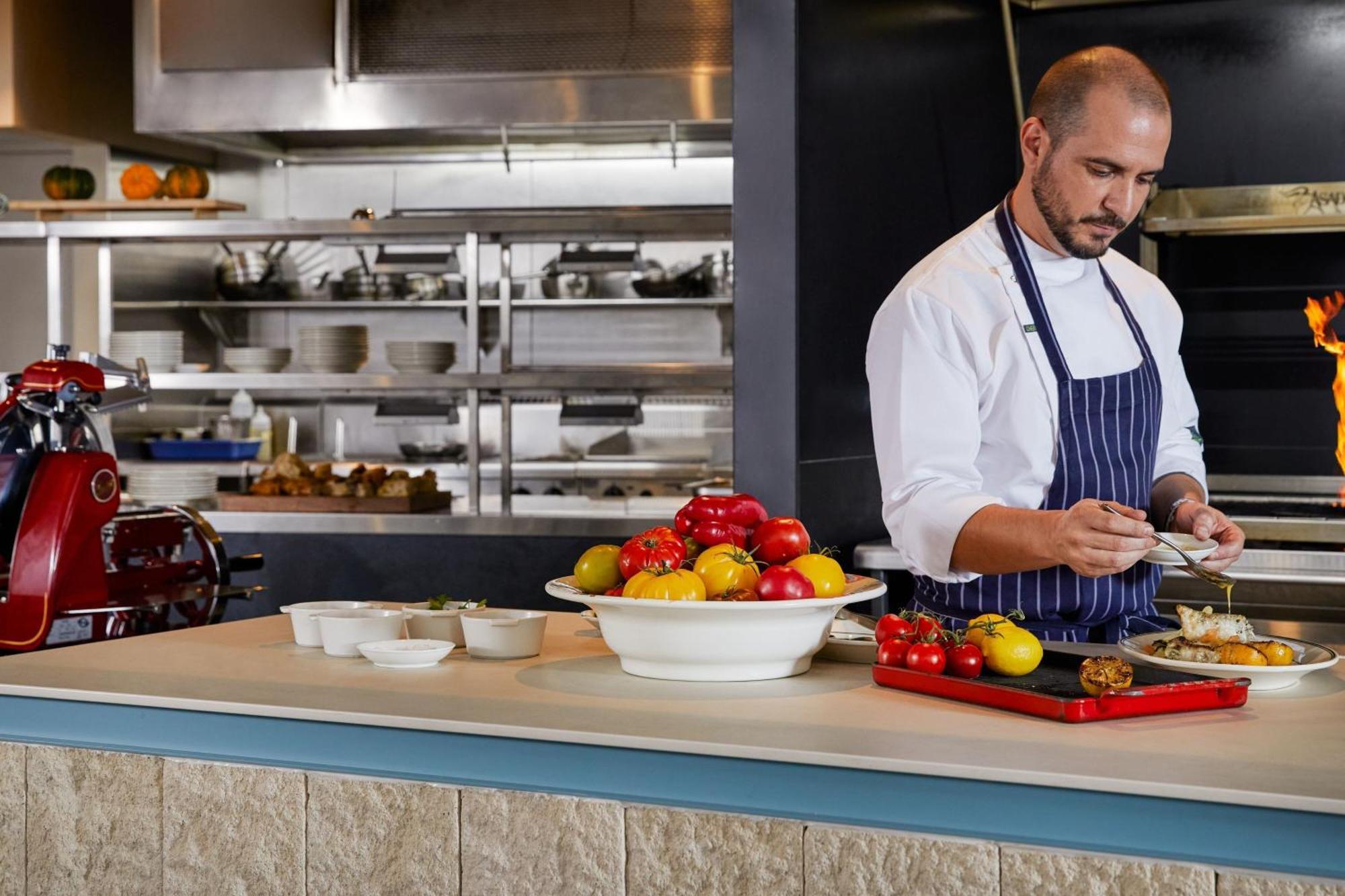 The Westin Brisbane Hotel Bagian luar foto A chef preparing food